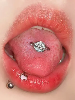 body-jewellery-planet-tongue-stud-2 Sparkling planet tongue stud piercing close-up - Bubbleoo